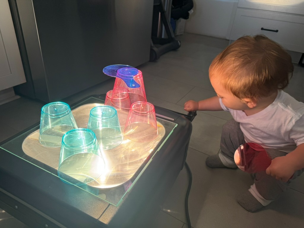 Baby playing color and overhead projector